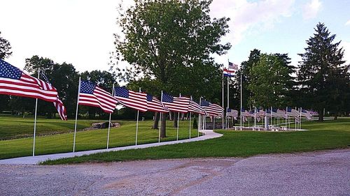 Scenic view of flag against sky