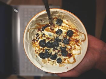 Cropped image of person holding breakfast