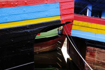 High angle view of multi colored boats moored in canal