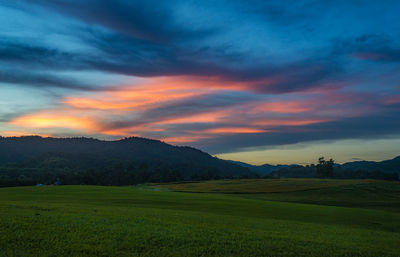 Scenic view of landscape against sky during sunset