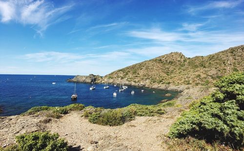 Scenic view of sea against blue sky