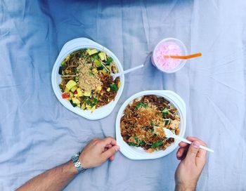 Cropped image of man eating food