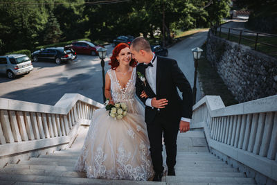 Full length of bridegroom walking on steps