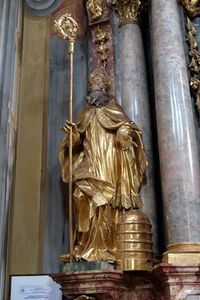 Low angle view of statue against building