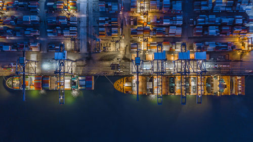 High angle view of container ship at commercial dock