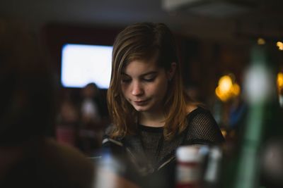 Portrait of woman looking at camera