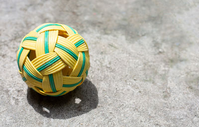 Sepak takraw ball on outdoor courts with copy space, thailand national sport.