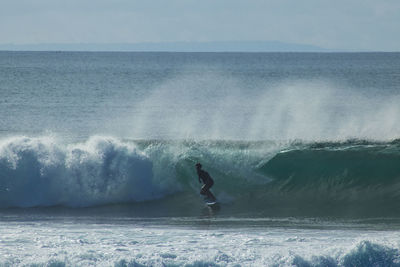 Man surfing on sea