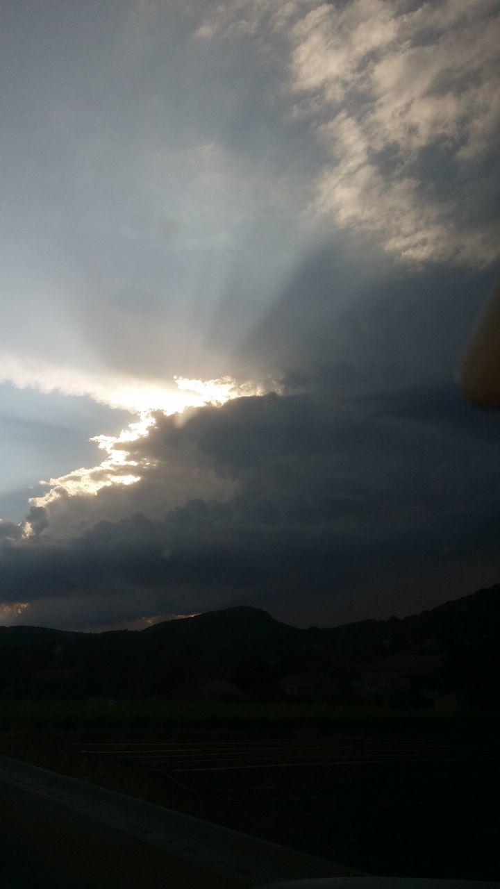 sky, scenics, cloud - sky, beauty in nature, tranquility, tranquil scene, sunset, nature, mountain, idyllic, cloud, silhouette, cloudy, cloudscape, outdoors, no people, majestic, weather, landscape, sunbeam