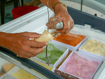 High angle view of man preparing food in kitchen