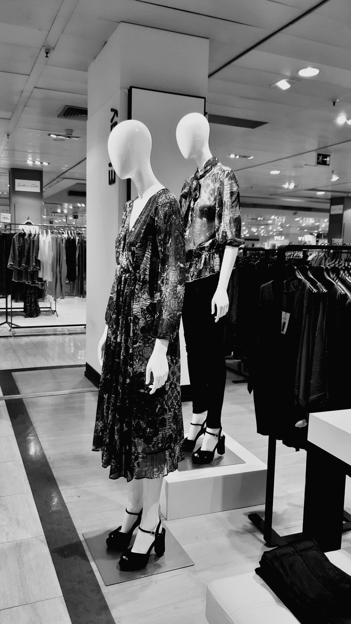 black, shopping, retail, store, white, fashion, clothing store, black and white, boutique, clothing, monochrome, mannequin, consumerism, shopping mall, indoors, adult, full length, customer, monochrome photography, business, department store, retail display, arts culture and entertainment, building, women, sale, business finance and industry, human representation, dress, footwear, wealth, luxury, elegance
