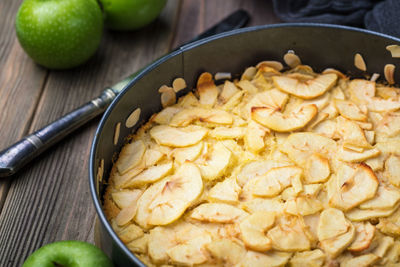 Homemade organic apple pie, resting in metal backing cake form.