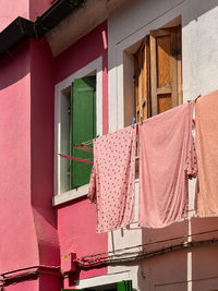 Low angle view of clothes hanging on wall