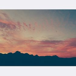 Scenic view of mountains at sunset