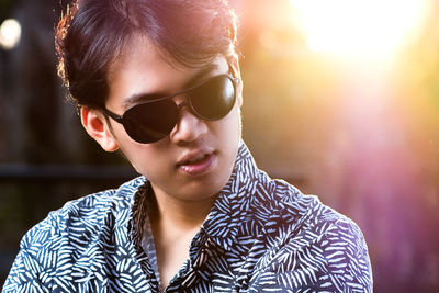 Close-up portrait of teenage boy wearing sunglasses