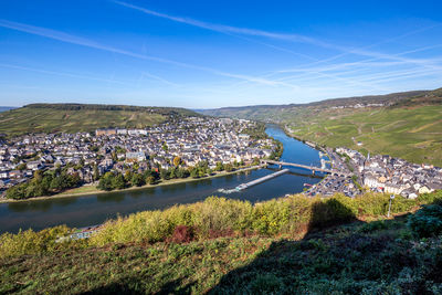 Aerial view of landscape and cityscape against sky