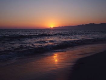 Scenic view of sea at sunset