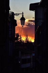 Silhouette of building against sky at night