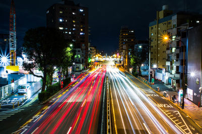 High angle view of light trails on road at night