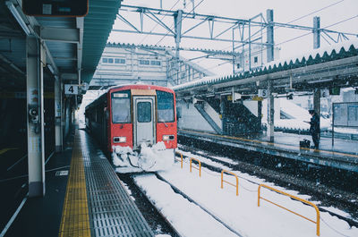 Train at railroad station during winter