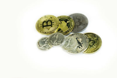 Close-up of coins on white background