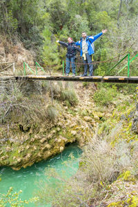 View of people on bridge over water