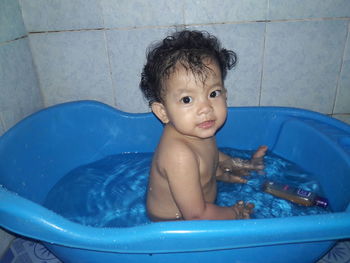 Portrait of cute baby girl in swimming pool