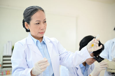 Side view of doctor examining patient at clinic