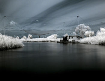 Scenic view of frozen lake against sky