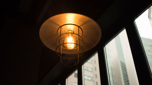 Low angle view of illuminated lamp