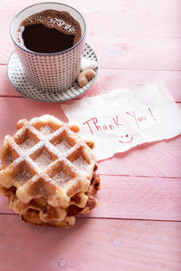 Close-up of coffee cup on table