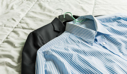 High angle view of formalwear on bed