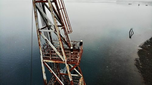 High angle view of cranes in lake