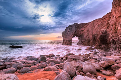 Scenic view of sea against sky with arche de port blanc in brittany, france