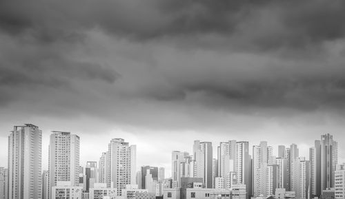 Modern buildings in city against sky