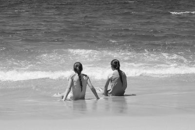 Friends relaxing on beach