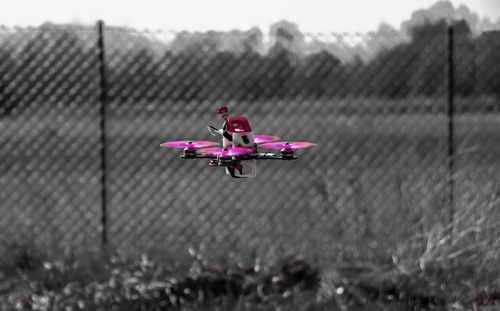 Airplane flying over field