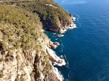 High angle view of rocks on sea