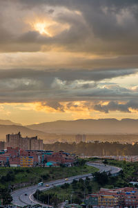 High angle view of buildings against sky during sunset