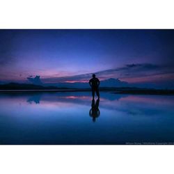 Scenic view of lake at sunset