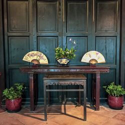 Potted plants on table outside house