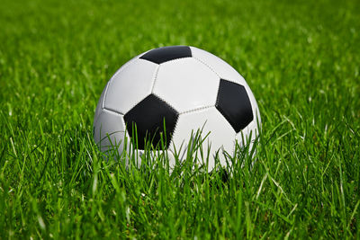 Close-up of soccer ball on field