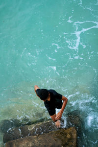 High angle view of man swimming in sea