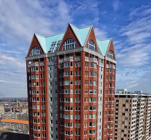 Low angle view of buildings in city against sky