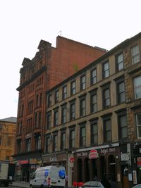 Low angle view of buildings against clear sky