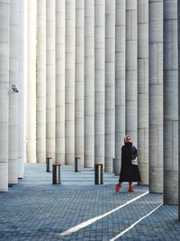 Rear view of woman walking on street