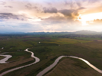 Scenic view of landscape against sky during sunset