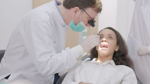 Doctor examining patient at clinic