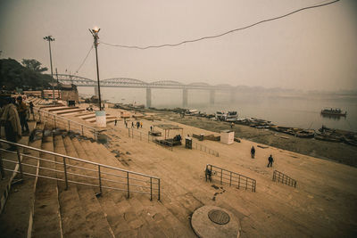 High angle view of street by sea against sky