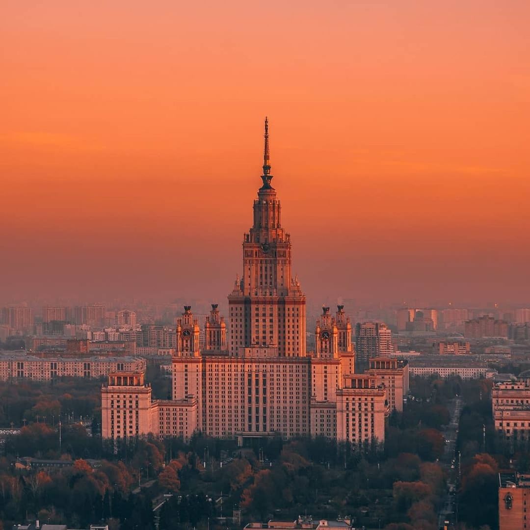 building exterior, architecture, built structure, building, sky, sunset, city, cityscape, travel destinations, nature, no people, orange color, travel, tower, residential district, dusk, place of worship, skyscraper, office building exterior, outdoors, romantic sky, spire